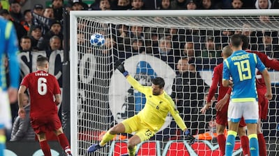 Liverpool's Alisson makes a last-gasp save to deny Napoli an equaliser. Reuters