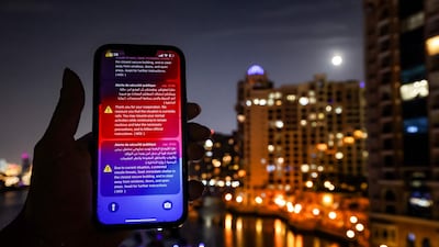 A safety alert sent by UAE authorities to residents over potential missile and drone threats from Iran. Photo: AFP