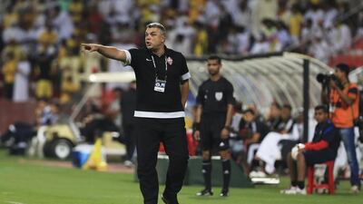 Cosmin Olaroiu, the prime director in Al Ahli's title run in the Arabian Gulf League, points out that the club is not done collecting silverware. Sarah Dea / The National