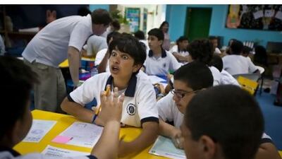 Hazza al Boushelaibi, 13, debates with his team members during the workshop yesterday.