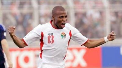 Jordan's Khalil Bani Ateyah celebrates after scoring the first goal in a 2-1 win over Japan in a World Cup Group B Asian qualifier on Tuesday. Khalil Mazraawi / AFP