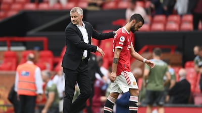 United manager Ole Gunnar Solskjaer consoles Bruno Fernandes after the match. Getty