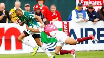 South Africa’s Cornal Hendricks is tackled by England’s Marcus Watson, but both teams failed to finish in the top two of their group. Jake Badger for The National