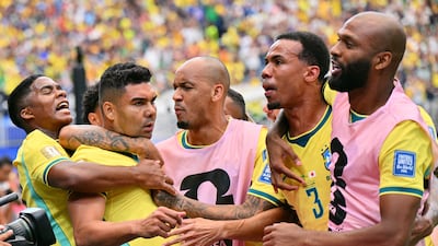 Casemiro celebrates with his Brazil teammates after scoring. EPA