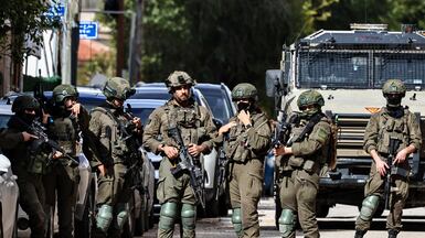 Israeli soldiers take up positions during a raid in Ramallah, in the occupied West Bank, on December 1 . AFP