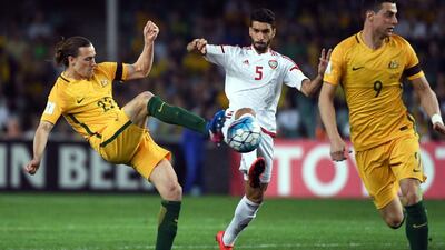 Australia’s Jackson Irvine, left, vies for the ball with the UAE’s Tariq Ahmed, centre, as Tomi Juric, right, looks away. William West / AFP