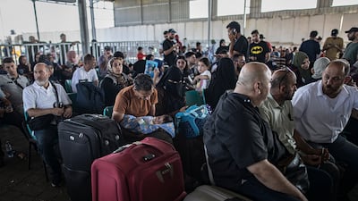 Palestinians wait to cross into Egypt at the Rafah border on November 1. EPA