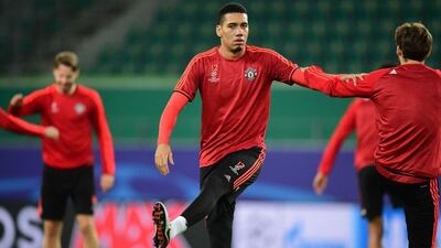 Manchester United’s Chris Smalling warms up on Monday at the team’s training session for their Tuesday Champions League contest. John MacDougall / AFP