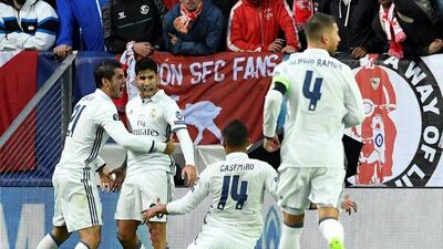 Real Madrid’s Spanish midfielder Marco Asensio (2nd L) celebrates with teammates during the Uefa Super Cup final football match between Real Madrid CF and Sevilla FC on August 9, 2016 at the Lerkendal Stadium in Trondheim. Jonathan Nackstrand / AFP