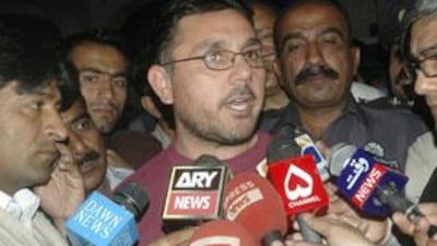 Pakistani student Tariq ur Rehman who was detained in Britain, talks to reporters upon his arrival at Islamabad airport.