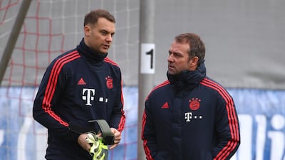 Bayern Munich interim coach Hansi Flick speaks with goalkeeper Manuel Neuer. Reuters