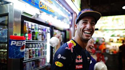 Daniel Ricciardo of Australia and Red Bull Racing at the Newton Food Centre during previews ahead of the Formula One Grand Prix of Singapore at Marina Bay Street Circuit on September 15, 2016 in Singapore. Mark Thompson / Getty Images