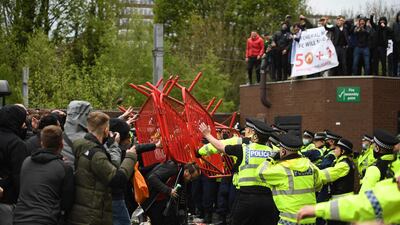 United fans clash with police outside of Old Trafford. AFP