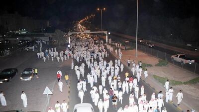 An image made available by the Kuwaiti Interior Ministry on July 4, 2014, shows supporters of Kuwaiti opposition leader and former parliament member Musallam Al Barrak as they protest late on July 2, 2014 in Kuwait City. AFP Photo