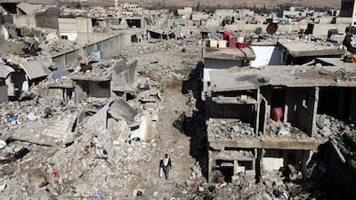 A man passes by buildings destroyed by Syrian air force air strikes in Damascus last month. Many places in the capital have had their character dramatically transformed by 22 months of revolt and war, just as Syria itself has been reshaped in the tumult of revolution. Goran Tomasevic / Reuters