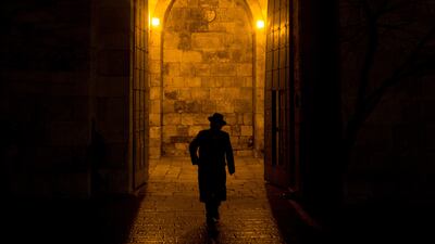 An Orthodox Jew walks through the Jaffa Gate in the Old City of Jerusalem. Getty Images