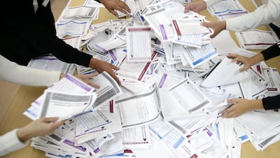 Officials count votes after presidential and parliamentary elections at a polling station in Bosnia and Herzegovina. Reuters