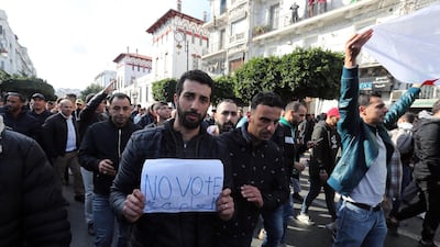 Algerians chant slogans during a protest rally in Algiers, Algeria. Thousands of people have taken to the streets in the capital Algiers calling for a mass boycott of the country's presidential elections, which is taking place on the day, and to voice against the five candidates running to replace ousted president Abdelaziz Bouteflika for being closely linked to the former regime. EPA