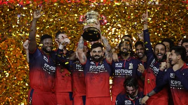 Cricket - Indian Premier League - IPL - Final - Royal Challengers Bengaluru v Gujarat Titans - Narendra Modi Stadium, Ahmedabad, India - May 31, 2026 Royal Challengers Bengaluru's Virat Kohli lifts the trophy as he celebrates with teammates after winning the Indian Premier League REUTERS / Amit Dave