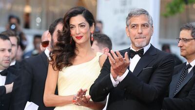 George and Amal Clooney arriving for the screening of Money Monster at the 69th Cannes Film Festival , France on May 12, 2016. On February 8, 2017, it was revealed that Mrs Clooney, the Lebanese-born human rights lawyer is expecting twins. Valery Hache / AFP