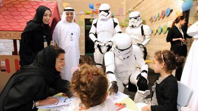 Twofour54 CEO Noura Al Kaabi and three Star Wars Stormtroopers paid a visit to children at Sheikh Khalifa Medical City in Abu Dhabi. Courtesy of twofour54