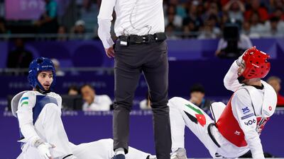 Ulugbek Rashitov (blue) of Uzbekistan and Zaid Kareem of Jordan in action. EPA