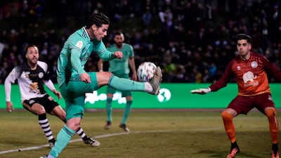 Real Madrid's Colombian midfielder James Rodriguez (C) kicks the ball during the Copa del Rey (King's Cup) football match between Unionistas de Salamanca CF and Real Madrid CF at Las Pistas del Helmantico stadium in Salamanca, on January 22, 2020. / AFP / JAVIER SORIANO