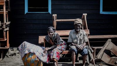 Two elderly people sitting on the roadside in Sake.