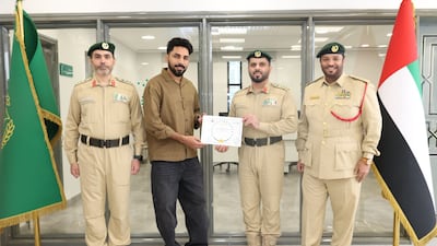 Mohammed Ali Sherakal Mohi is honoured by officers at Al Raffa Police Station. Photo: Dubai Police