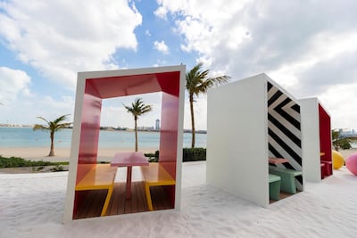 Dining booths on the beach at Torno Subito. Photo: Chris Whiteoak / The National