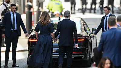 Mr and Mrs Starmer leave Downing Street. AFP