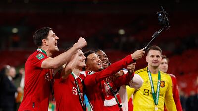 Manchester United's Jadon Sancho celebrates with Marcel Sabitzer, Harry Maguire and Anthony Elanga. Reuters