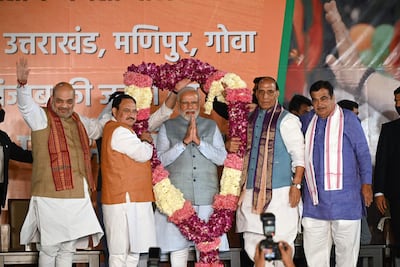 Indian Prime Minister Narendra Modi is felicitated at the BJP headquarters in New Delhi last March. AFP