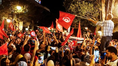 People react after exit poll results were announced in a second round runoff of the presidential election in Tunis, Tunisia October 13, 2019. Reuters