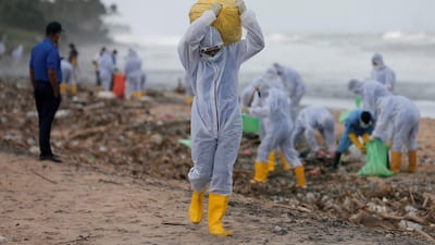 Bags of debris being removed from a beach in Ja-Ela, Sri Lanka. Reuters