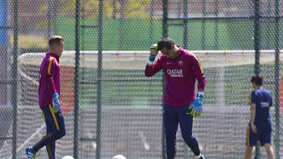 FC Barcelona’s goalkeepers Chilean Claudio Bravo (R) and German Marc-Andre ter Stegen take part in a training session held at the Joan Gamper sports complex in Barcelona, northeastern Spain, 21 May 2016. FC Barcelona will face Sevilla FC in the Copa del Rey final on 22 May. Alejandro Garcia / EPA