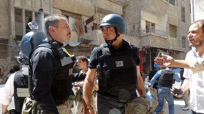 United Nations arms experts inspect the site of a suspected chemical weapons attack the Damascus suburb of Ghouta last month. Mohamed Abdullah / AFP
