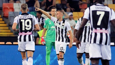 Udinese's Gerard Deulofeu celebrates levelling the scores at 2-2. AP