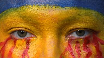 Lidiya Zhuravlyova, an Ukrainian performance artist, takes part in an anti-war protest in Bangkok, Thailand. Reuters