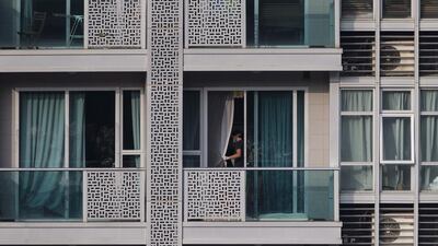 A Hong Kong policeman checks the crime scene where the bodies of two women were found in a flat in an upmarket district at Hong Kong's Wanchai on November 2, 2014. A Bank of America Merrill Lynch employee has been arrested in connection with the murder. Tyrone Siu/Reuters