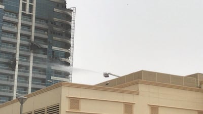 Emergency services work to put out the fire at Zen Tower in Dubai Marina. 13 May 2018. Leslie Pableo for The National