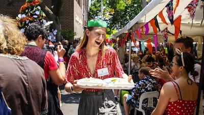 Volunteer Christian Wilkins hands out plates at the Wayside Chapel Christmas Lunch in Sydney, Australia. Getty Images