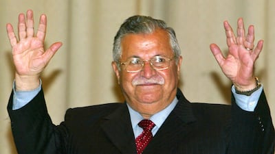 April 7, 2005: Veteran Kurdish leader Jalal Talabani raises his hands after being sworn in as Iraq's first democratically elected president. Later that month, Shiite Islamist Ibrahim Al Jaafari takes office as prime minister, hailing from the exiled Dawa Party. Getty