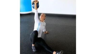 Start on the floor with one arm outstretched and the other pointing towards the ceiling. Satish Kumar / The National