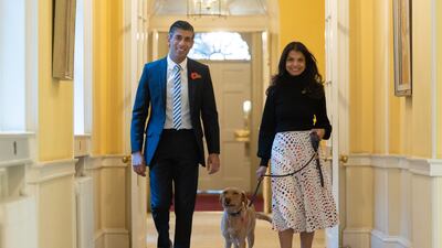 Mr Sunak and his wife Akshata Murty with Nova, their pet Labrador. Photo: Simon Walker / No 10 Downing Street