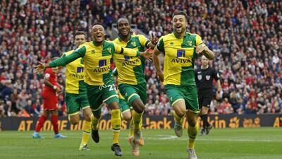 Russell Martin celebrates scoring the first goal for Norwich against Liverpool. Craig Brough / Reuters