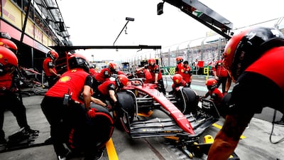Pit crew work on Ferrari driver Charles Leclerc's car at the Albert Park Circuit in Melbourne. AFP