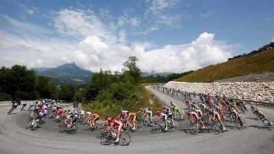 The peloton negotiates a tight bend on Stage 18 of the Tour de France from Gap to l’Alpe d’Huez on Friday.