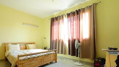 BEFORE — The challenge: The room was fitted with extremely high windows, so finding appropriate curtains was an issue. Also there were electrical holes on the wall, at eye level, which were an eyesore. The winner: Quantella Nicholas, UAE.