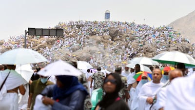 Muslim pilgrims, some holding parasols, pray on Mount of Mercy in Arafat ahead of the Eid al-Adha festival in the holy city of Mecca, Saudi Arabia. Reuters